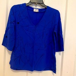 Women’s blouse by DKNY.